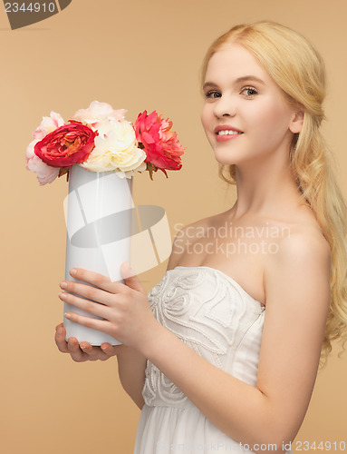 Image of woman with vase of flowers