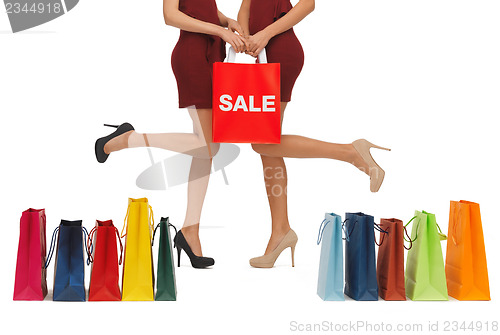 Image of long legs with shopping bags