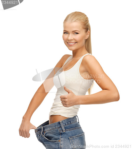 Image of sporty woman showing big pants