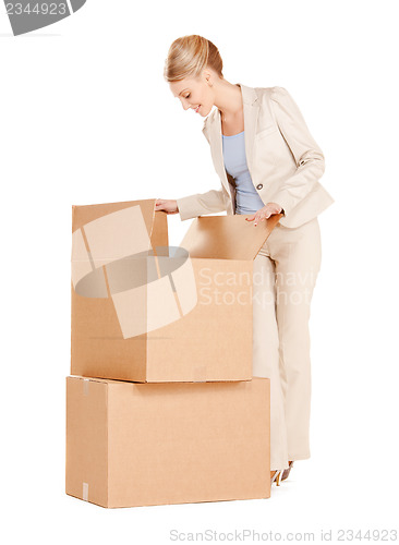 Image of businesswoman with big boxes