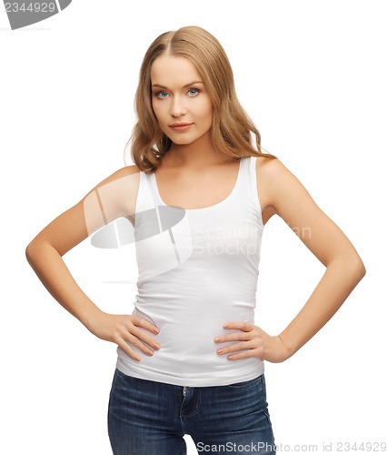 Image of calm and serious woman in blank white t-shirt