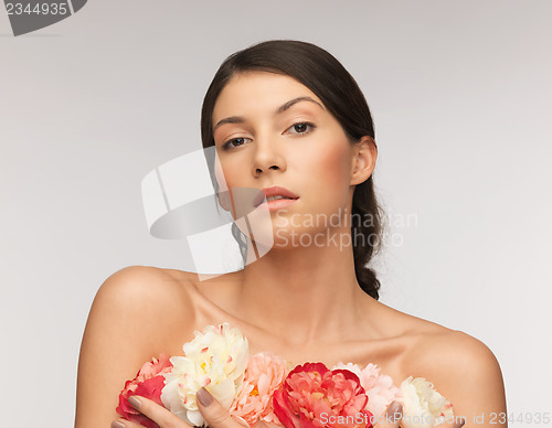 Image of relaxed woman with flowers