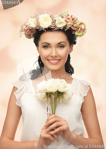 Image of woman wearing wreath of flowers