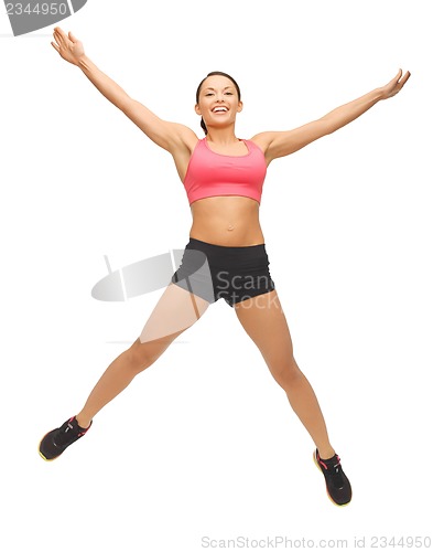 Image of beautiful sporty woman doing exercise