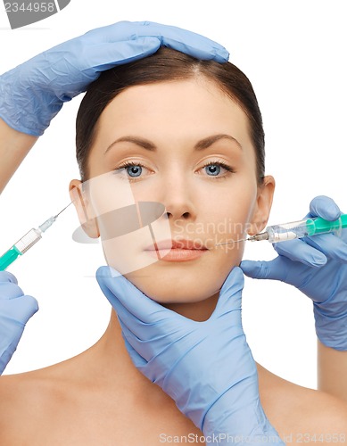 Image of woman face and beautician hands