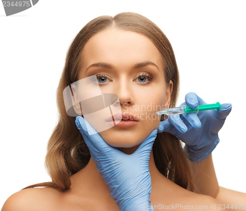 Image of woman face and beautician hands