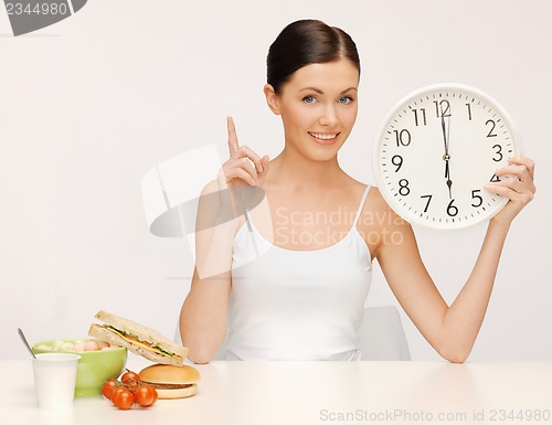 Image of woman with big clock