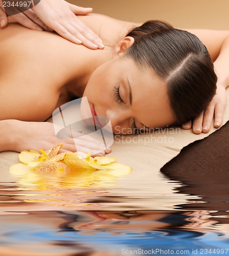 Image of beautiful woman in massage salon