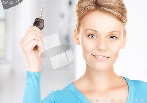 Image of happy woman with car key