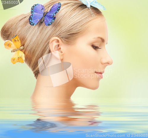 Image of woman with butterflies in hair