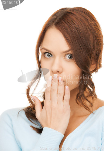 Image of amazed woman with hand over mouth