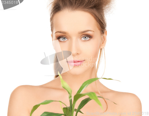 Image of woman with green sprout