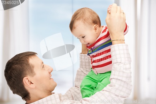 Image of happy father with adorable baby