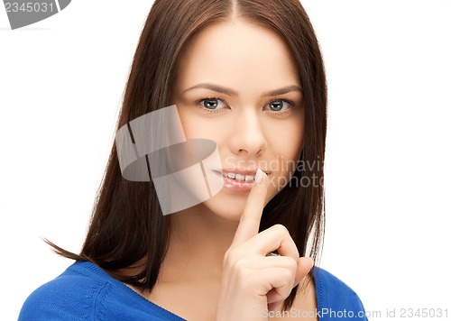 Image of woman with finger on her lips