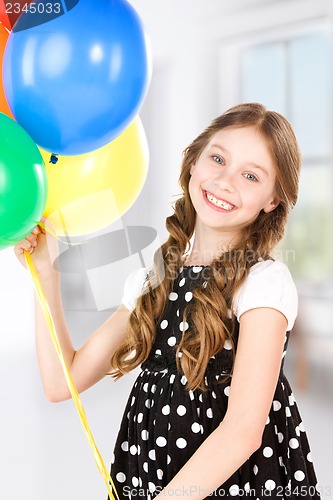 Image of happy girl with colorful balloons