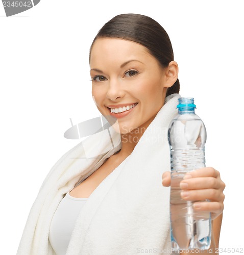 Image of woman with towel and bottle of water