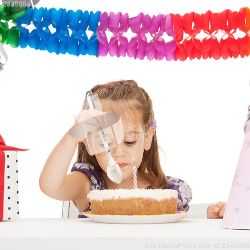 Image of litle girl with birthday cake