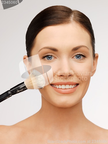 Image of beautiful woman with brush