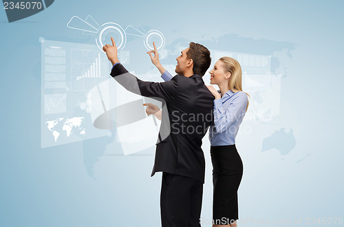 Image of man and woman working with virtual screen