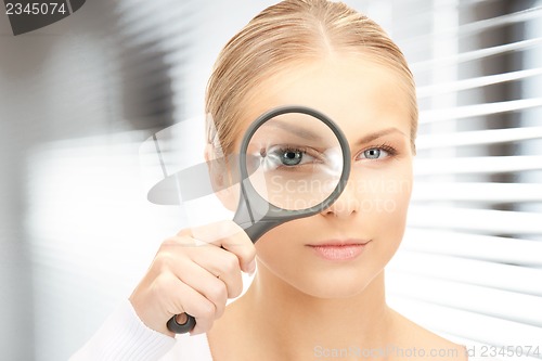 Image of woman with magnifying glass