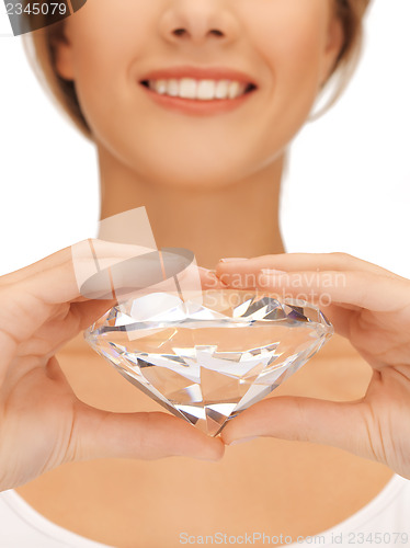 Image of woman's hands showing big diamond