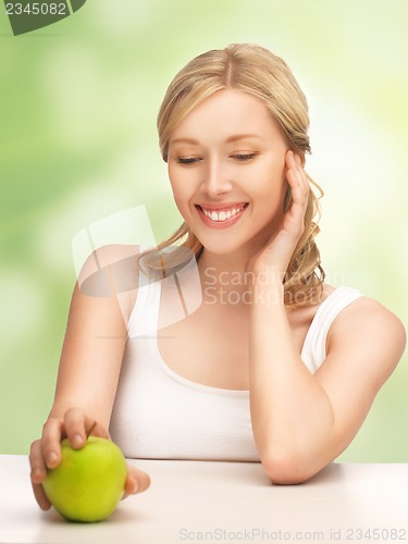 Image of woman with green apple