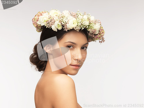 Image of woman wearing wreath of flowers