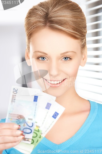 Image of businesswoman with euro cash money