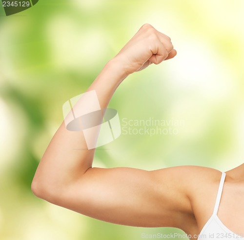 Image of sporty woman flexing her biceps