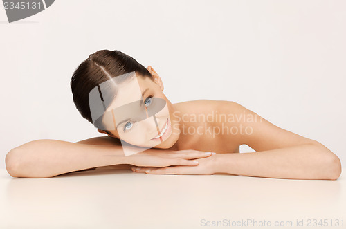 Image of face and hands of beautiful woman