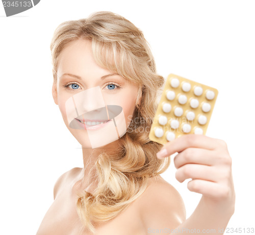 Image of woman with pills