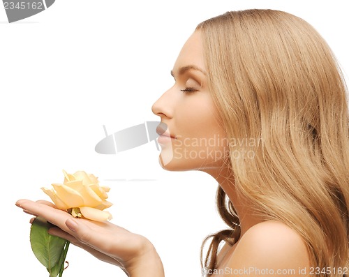 Image of lovely woman with rose flower