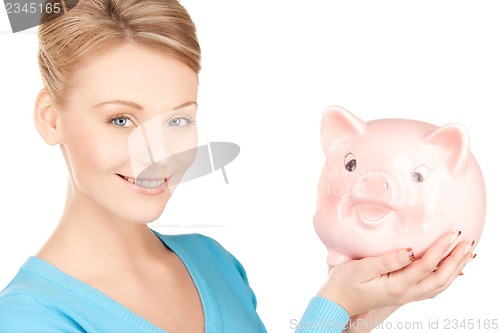 Image of lovely woman with big piggy bank