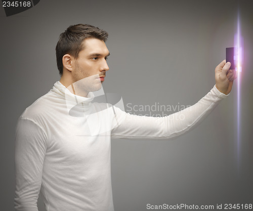 Image of man with access card