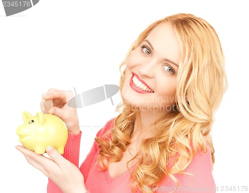 Image of woman with piggy bank and cash money