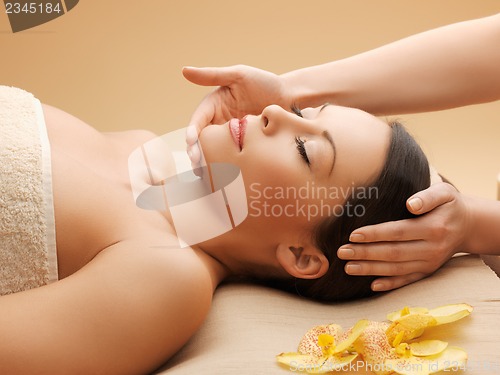 Image of beautiful woman in massage salon