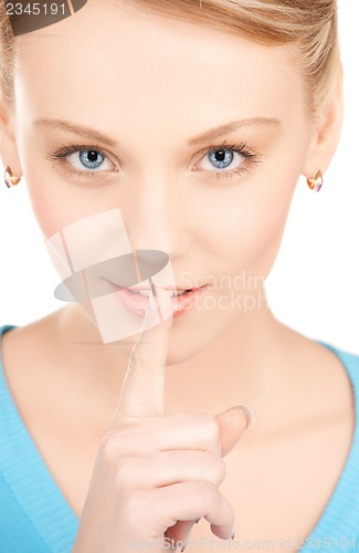 Image of woman with finger on her lips