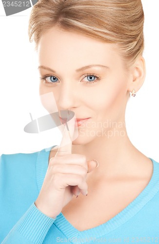 Image of woman with finger on her lips