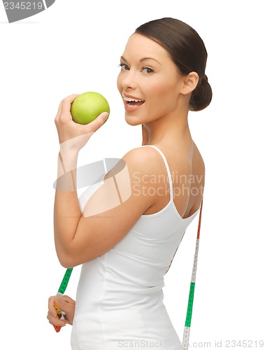 Image of woman with measuring tape and apple