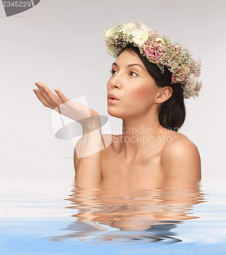 Image of woman wearing wreath of flowers