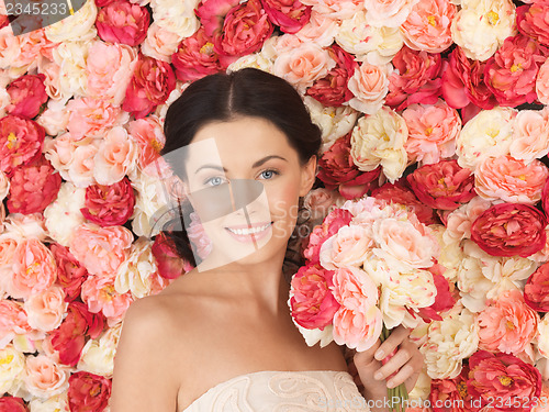 Image of woman with background full of roses