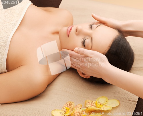 Image of beautiful woman in massage salon