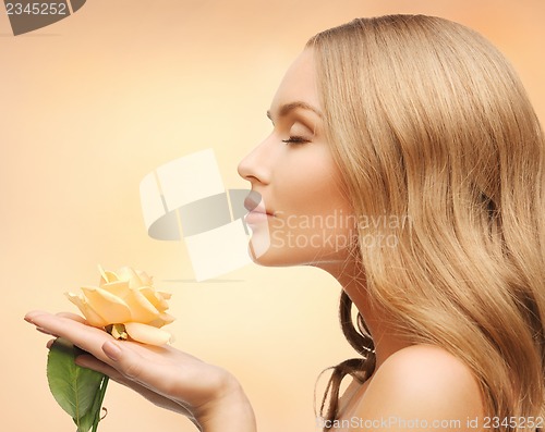 Image of lovely woman with rose flower