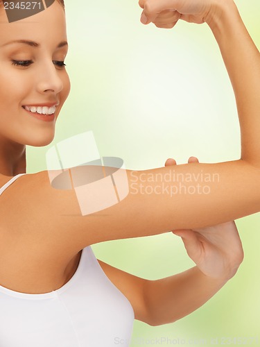 Image of sporty woman flexing her biceps