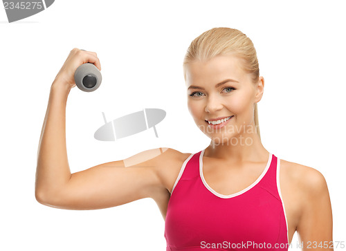 Image of young sporty woman with light dumbbell