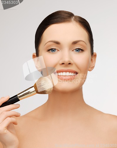 Image of beautiful woman with brush