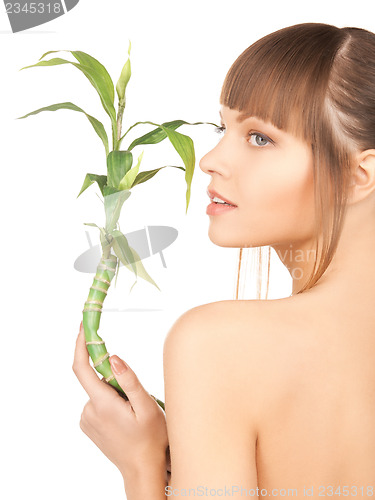 Image of woman with green sprout