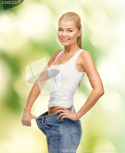 Image of sporty woman showing big pants