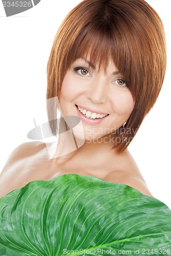 Image of woman with green leaf