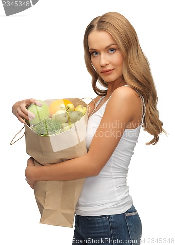 Image of woman with shopping bag full of fruits